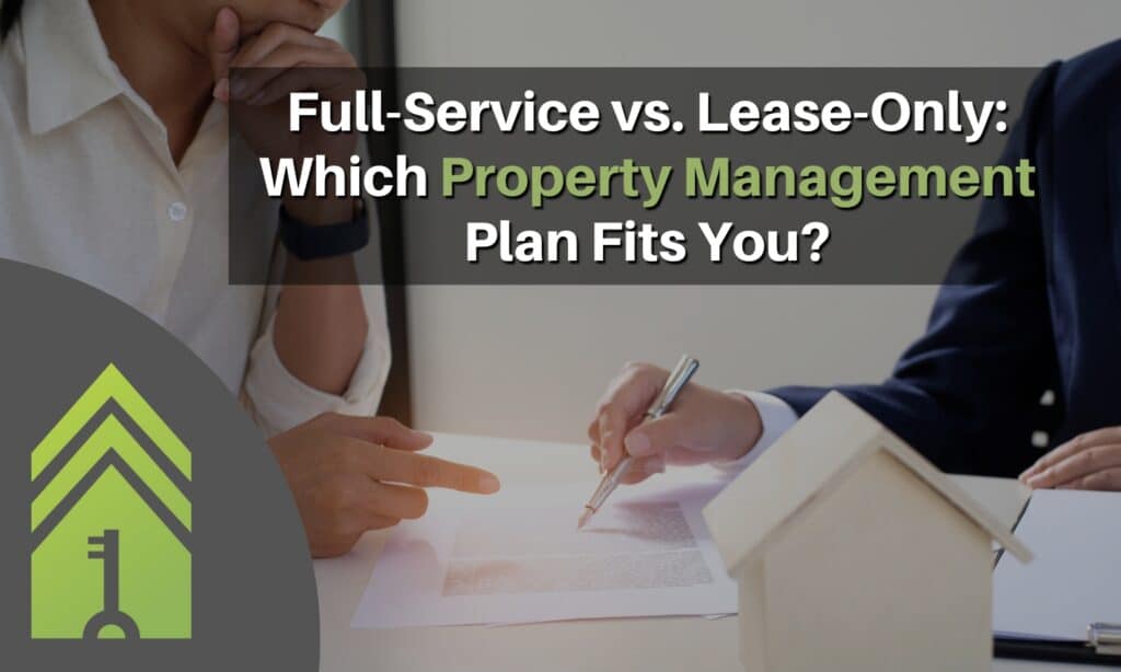 Two people reviewing a rental agreement at a desk, representing full-service vs. lease-only property management options.